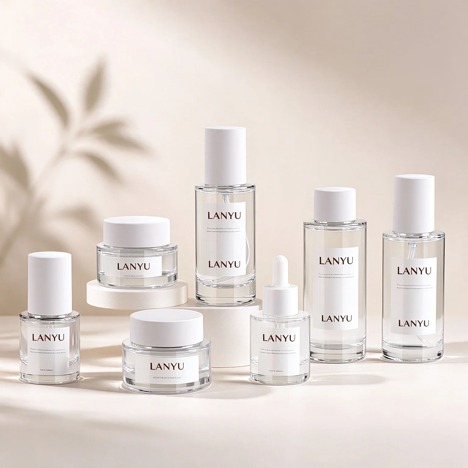 Clear glass packaging family with white closures, dropper and jars
